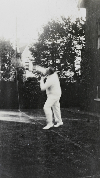 Hedgeland playing tennis in Hong Kong