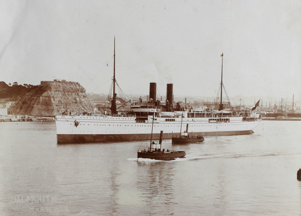 Steamboat and tugs in a harbour