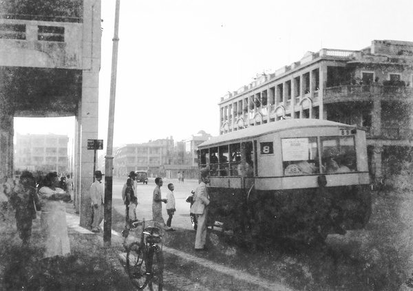 Passengers queueing to board a number 8 bus, Prince Edward Road, Kowloon, Hong Kong