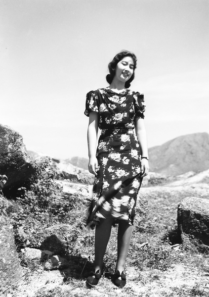 Bea Hutchinson modelling a flower print dress, Hong Kong