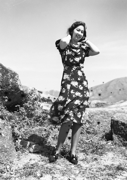 Bea Hutchinson modelling a flower print dress, Hong Kong