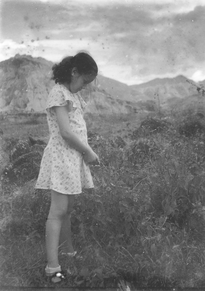 Kristine Thoresen standing on the rough ground near the Army Sports Ground, Mongkok, Hong Kong