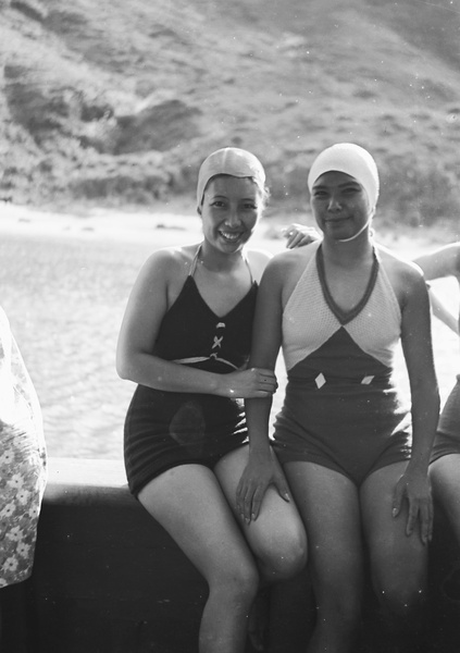 Two unidentified women wearing bathing costumes on a boat, Hong Kong
