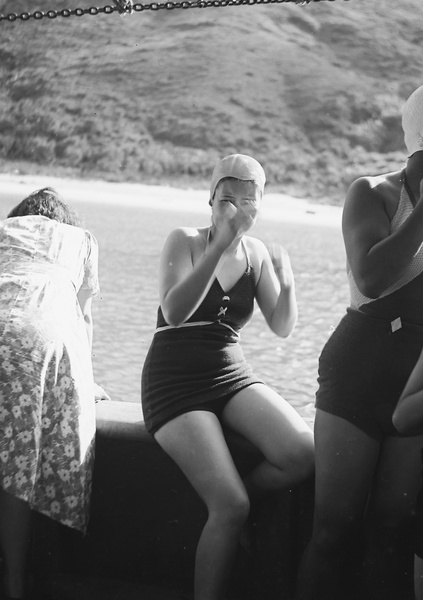 Two unidentified women wearing bathing costumes on a boat, Hong Kong