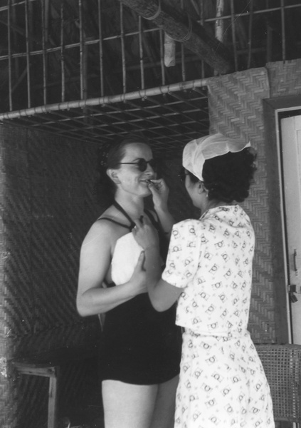 Lucy Shirazee and a friend at a beach hut, South Bay Beach, Hong Kong