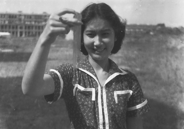 Bea Hutchinson holding up a test tube, Shing Mun Reservoir, Hong Kong