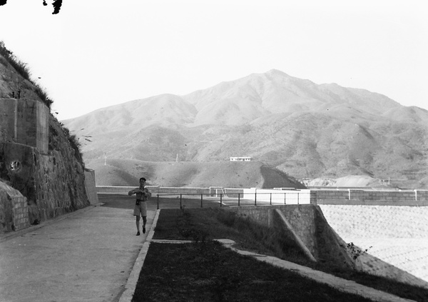 Unidentified young man on a walkway, Shing Mun Reservoir, Hong Kong