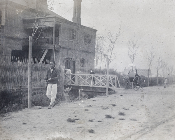 Elizabeth Hutchinson, two boys, and a rickshaw puller on Tongshan Road, Hongkou, Shanghai