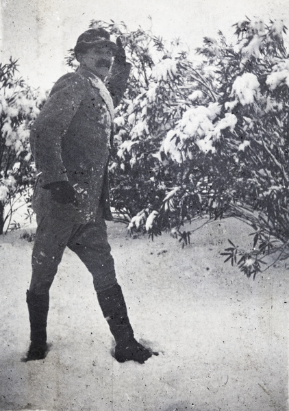 Man throwing snowballs in the garden of 35 Tongshan Road, Hongkou, Shanghai