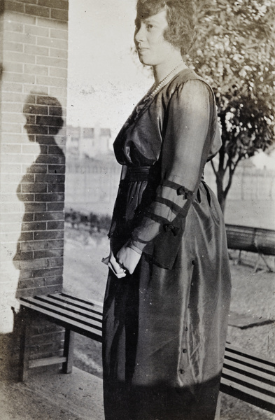Young woman wearing an evening dress on the verandah of 35 Tongshan Road, Shanghai