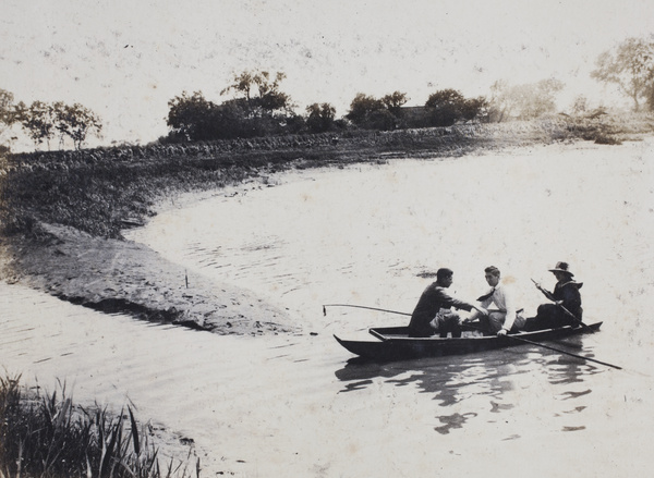 Two men and a woman in a punt, Shanghai