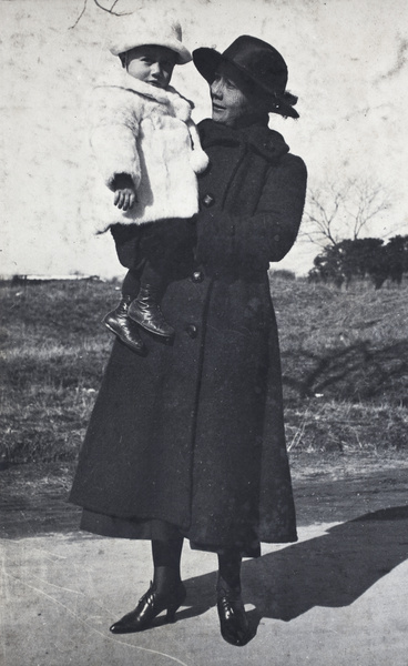 Woman and child wearing winter coats, Shanghai