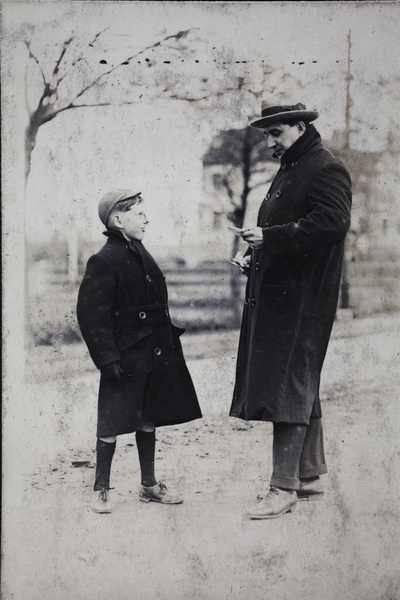 Charles Hutchinson and neighouring boy with chocolate bars, Tongshan Road, Hongkou, Shanghai