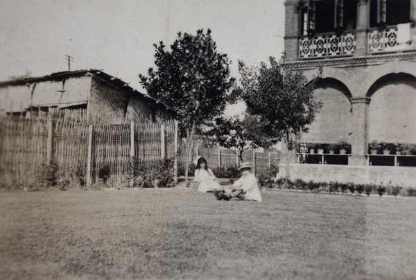 Maggie and Fred Hutchinson sitting on the lawn, 35 Tongshan Road, Hongkou, Shanghai