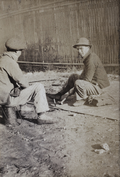 Two men at work on Tongshan Road, Hongkou, Shanghai