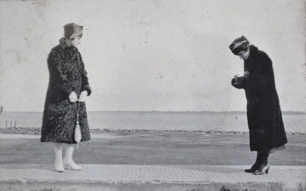 Two young women, one with a camera, Wusong, February 1920