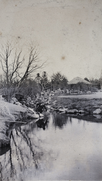 John Piry beside a stream in a park, Shanghai, March 1920