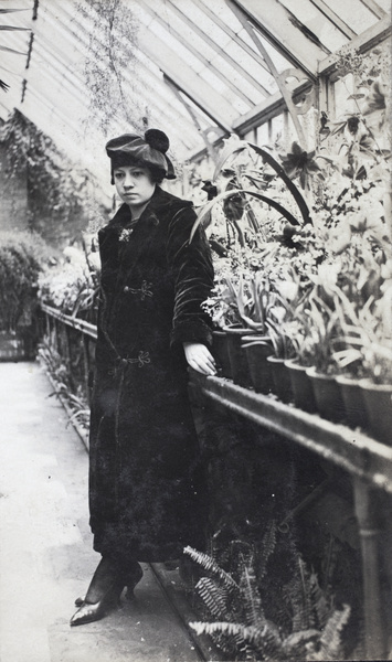 Young woman in the Sincere Department Store roof garden glasshouse, Shanghai