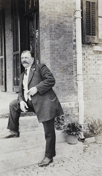 Mr Belyea standing at the steps to the verandah, 35 Tongshan Road, Hongkou, Shanghai