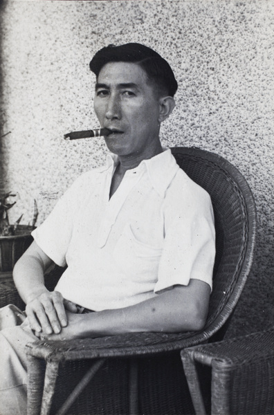 Tom Hutchinson smoking a cigar, Prince Edward Road, Kowloon, Hong Kong