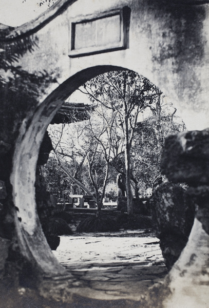 Courtyard garden framed by a moon gate