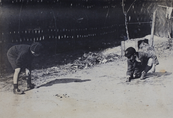 Fred Hutchinson playing marbles with neighbouring boy, 35 Tonghsan Road, Hongkou, Shanghai