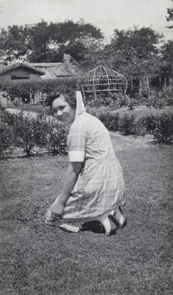 Hannah kneeling on the garden lawn, 35 Tongshan Road, Hongkou, Shanghai