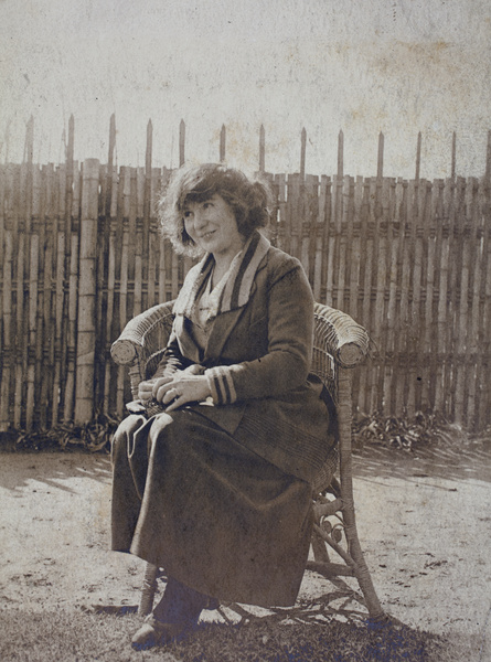Mrs Koskey sitting on a garden chair, 35 Tongshan Road, Hongkou, Shanghai