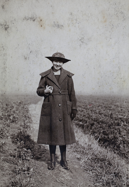 Sarah Hutchinson walking on a path beside fields near Tongshan Road, Hongkou, Shanghai