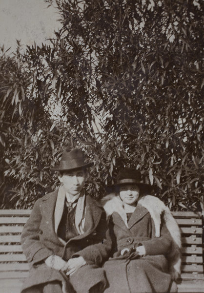 Tom and Sarah Hutchinson sitting on a park bench, Shanghai