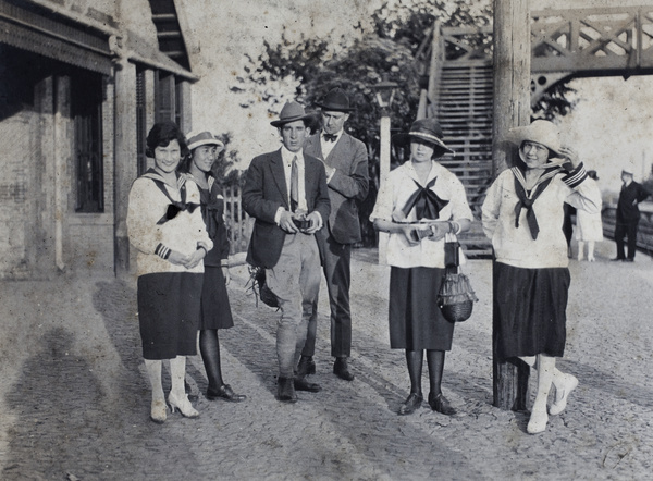 Maggie Hutchinson, John Henderson, Mabel Parker and other friends waiting in a rail station on their return from a day trip to Kunshan