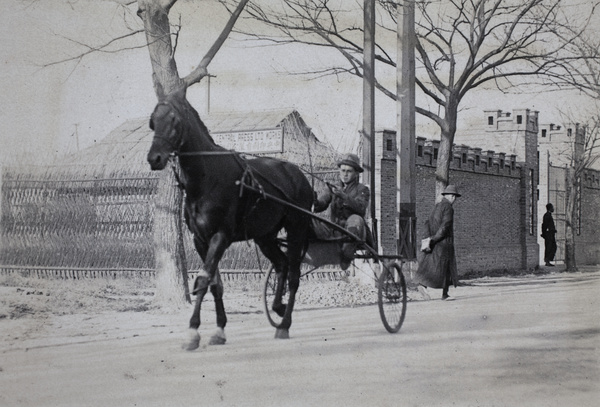 Horse with single-seat carriage and driver passing press works, near 35 Tongshan Road, Hongkou, Shanghai