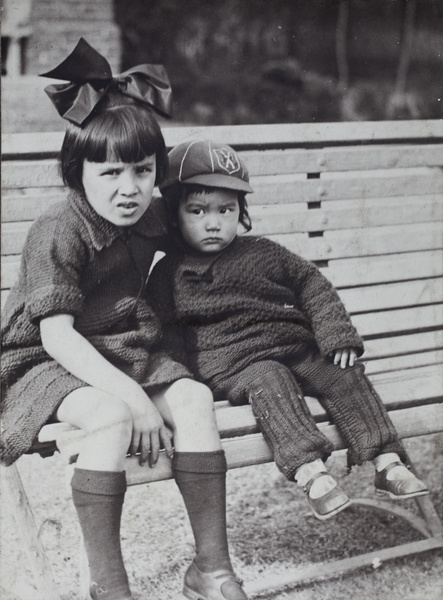 Miss Oliveira sitting with Bea Hutchinson on a garden bench, 35 Tongshan Road, Hongkou, Shanghai