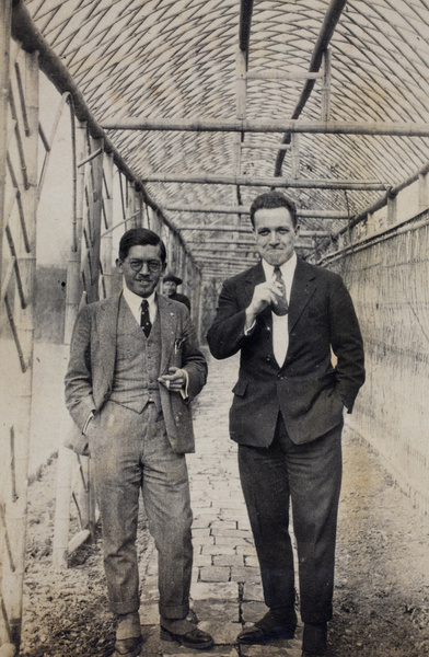 Unidentified man with Thomas Kirby standing under a garden trellis, 35 Tongshan Road, Hongkou, Shanghai