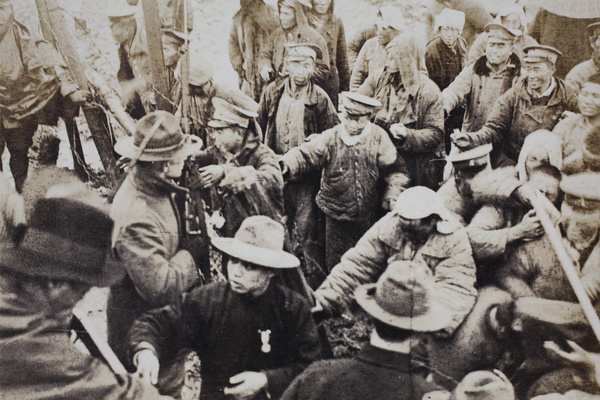 Barbed wire fence separating American Company Shanghai Volunteer Corps from civilians and soldiers at the Avenue Haig internment camp, Shanghai