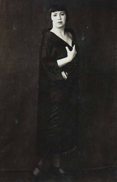 Unidentified woman wearing a fashionable dress coat and bobbed hair, Hongkou, Shanghai