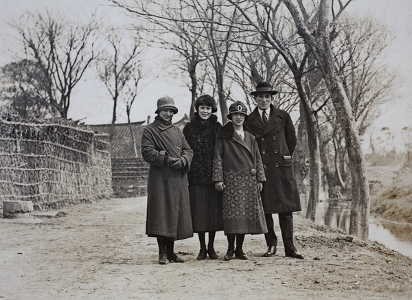 Sarah, Mabel and Maggie Hutchinson with John Henderson by a waterway near Tongshan Road, Hongkou, Shangha