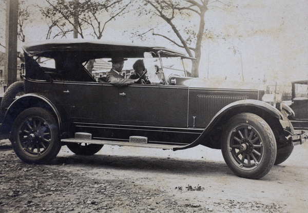 Unidentified driver and passenger in an automobile, Tongshan Road, Hongkou, Shanghai