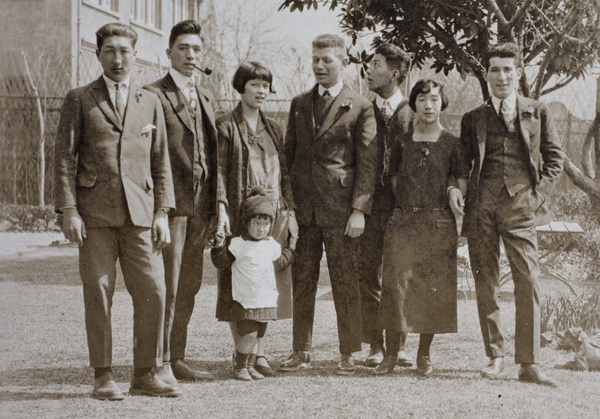 Unidentified man with Dick, Bill, Mabel, Bea, Harry and Maggie Hutchinson, and John Henderson, in the garden, 35 Tongshan Road, Hongkou, Shanghai