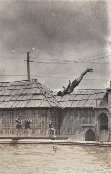 Diving from a high platform into the Open Air Pool, Hongkou, Shanghai