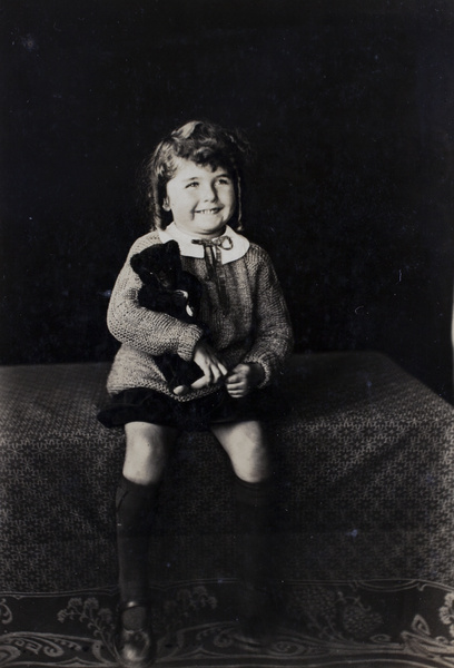 Phyllis Koskey with a teddy bear, Shanghai