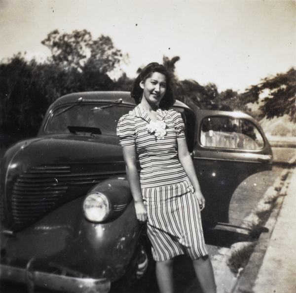 Bea Hutchinson leaning against a car, Hong Kong