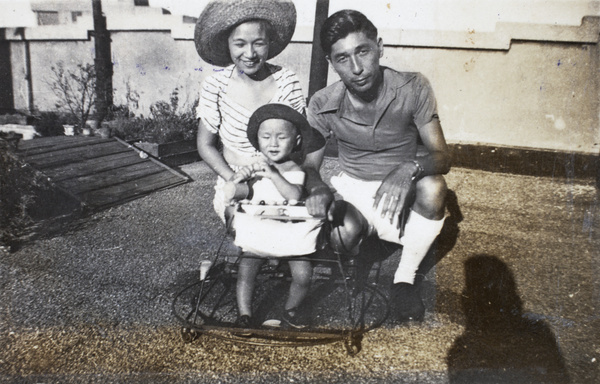 Lucy and Fred Hutchinson, with Roy in a walker, on the roof terrace, Appartement 63, 6 Route Voyron, Shanghai