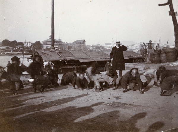 Children gathering thrown coins