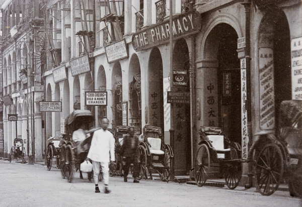 Businesses and rickshaws on Queen's Road, Hong Kong