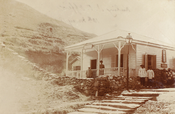 Mr and Mrs Hughes on veranda, Kuling Post Office