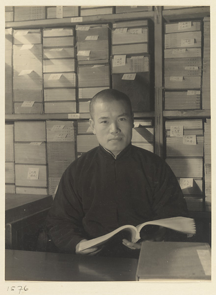 Man seated in a bookshop