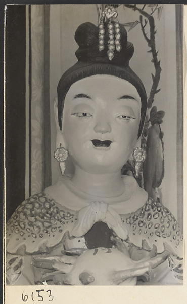 Detail of a shrine figure at the Sheng mi zhi tang Monastery