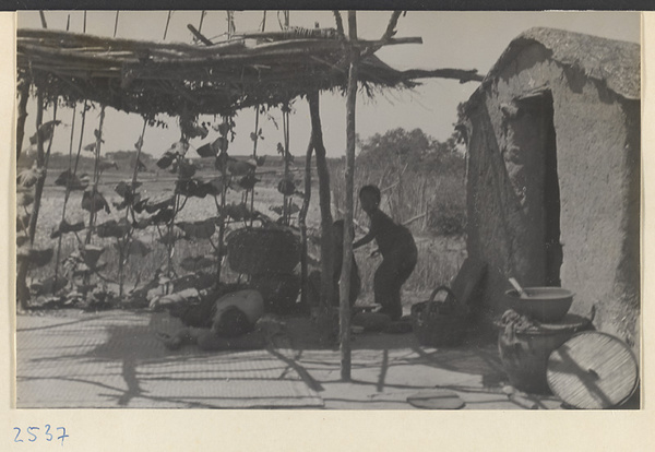 House and free-standing shade porch on the way to the Lost Tribe country