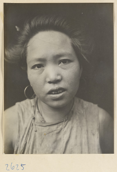 Woman with teapot hairstyle and earrings in the Lost Tribe country